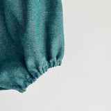 Bella Romper in shimmery green linen